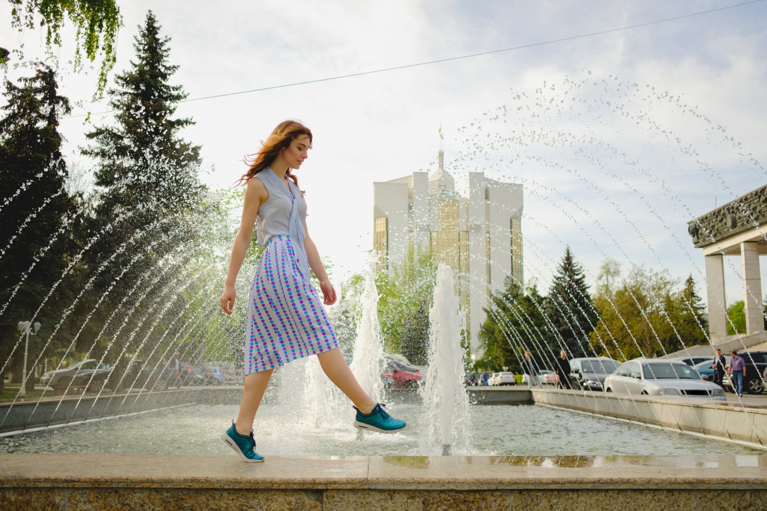 Elegant lady walking alone in the street